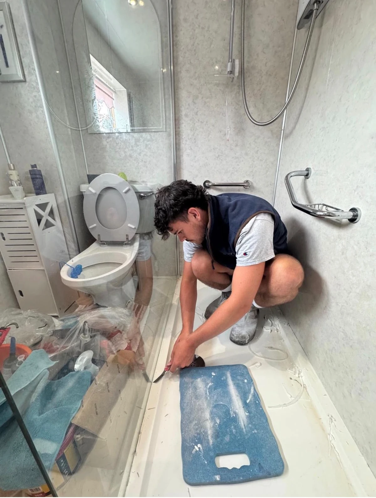 Harry working on a shower tray