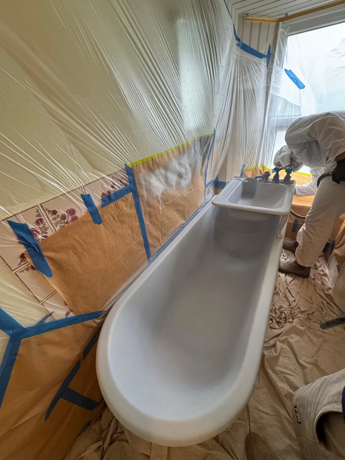 A protected bathroom during specialist bath refinishing